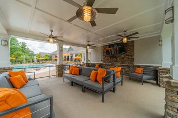 Poolside kitchen with grills and social lounge